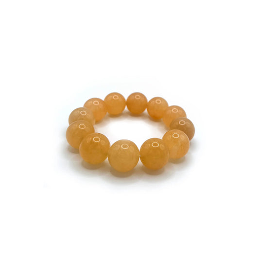 Vibrant orange Soda Pop Charm Bracelet resembling a mochi donut with 18mm golden silk jade beads.