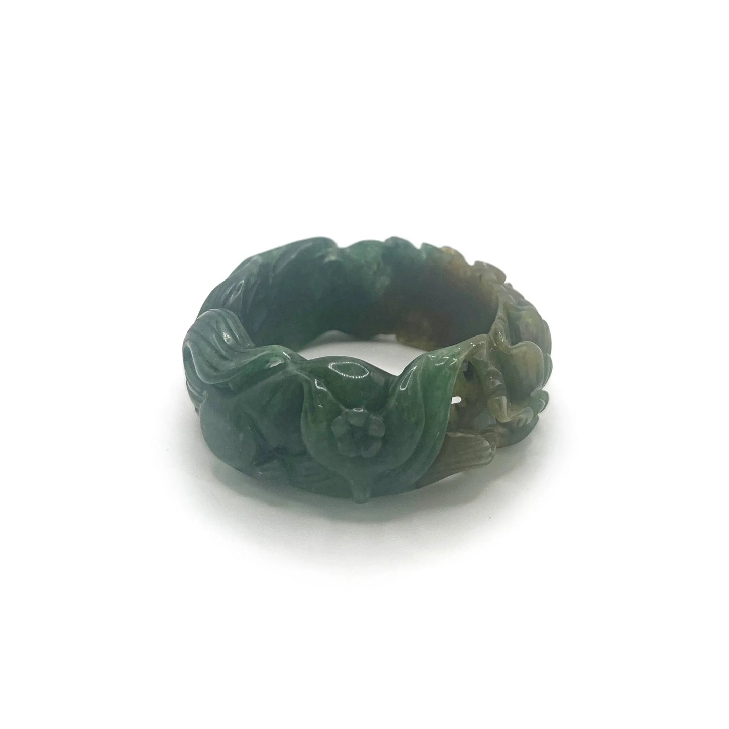 Carved jade bracelet in emerald Mongolian quartzite, featuring hand-carved peony and nine-tailed kitsune symbols with vibrant yellow detailing.
