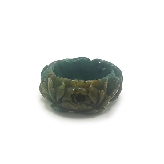 Carved jade bracelet in emerald Mongolian quartzite, featuring hand-carved peony and nine-tailed kitsune symbols with vibrant yellow detailing.