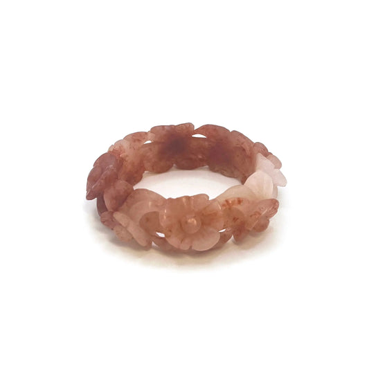 Bangle for small wrists featuring hand-carved cherry blossom motifs in vibrant red and translucent white natural stone with a hollowed, floral design.
