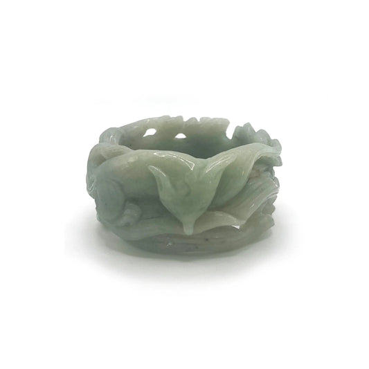 Artistic jewelry for women featuring a hand-carved Mongolian jade bangle with nine-tailed fox and floral motifs in vibrant green tones. - miruzi
