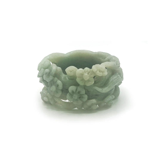 Artistic jewelry for women featuring a hand-carved Mongolian jade bangle with nine-tailed fox and floral motifs in vibrant green tones. - miruzi
