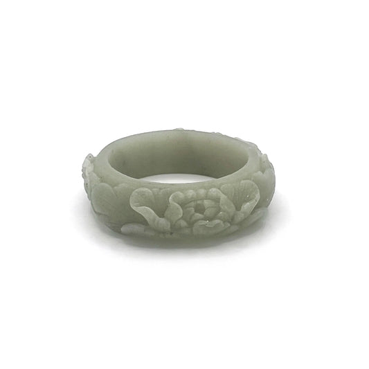 Hand-carved Mongolian jade bangle with phoenix and peony design.