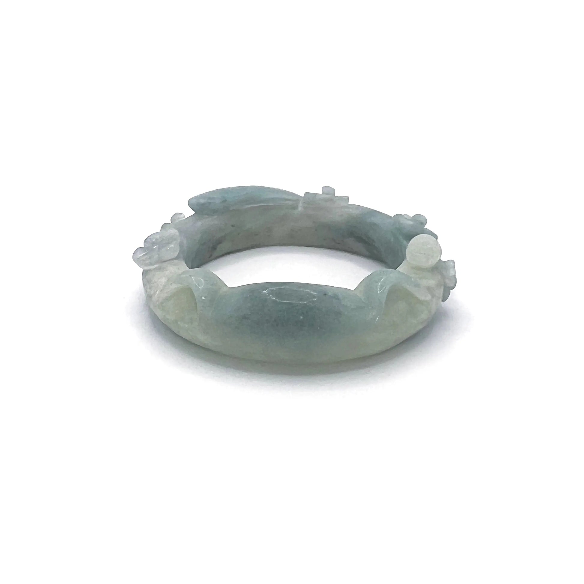 Hand-carved Sky Whiskers Cat Ear jade bangle with feline motifs in sky-blue Mongolian Quartzite.