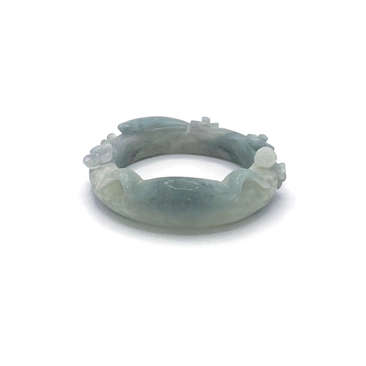 Hand-carved Sky Whiskers Cat Ear jade bangle with feline motifs in sky-blue Mongolian Quartzite.