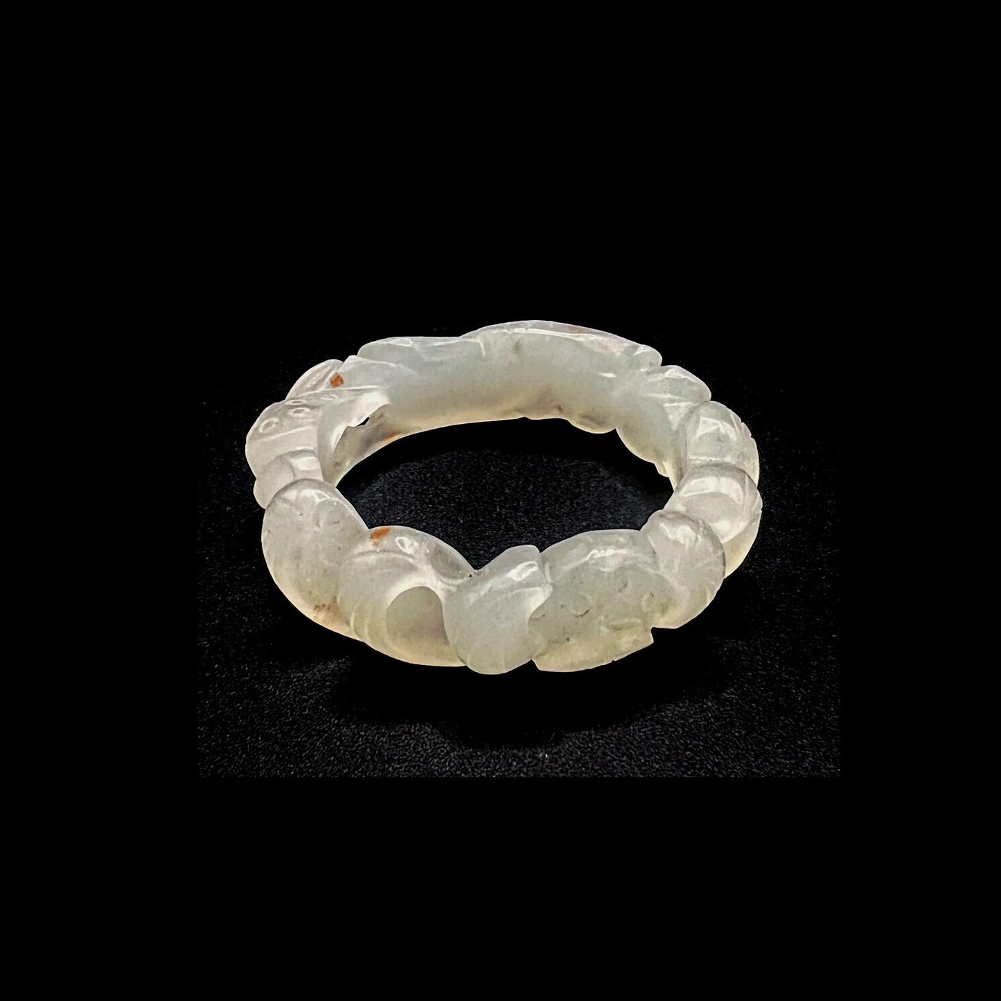 Hand-carved white jade lotus flower bracelet with koi fish motifs, symbolizing purity and prosperity.