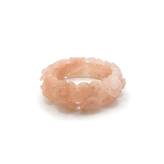 Carved jade bangle with dual-layer floral design in pink and orange Mongolian jade, hand-carved for artisan elegance and natural sunset beauty.