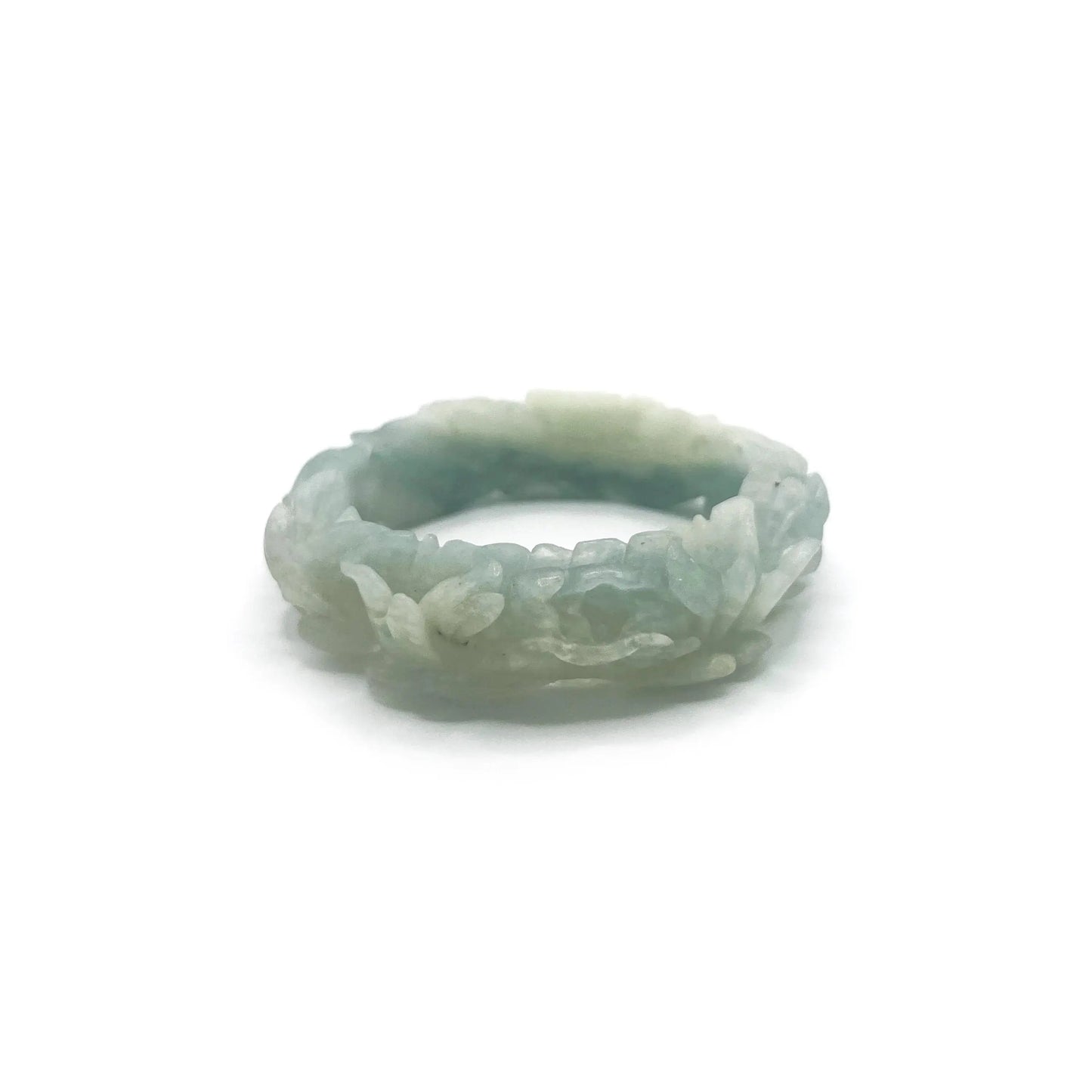 Hand-carved blue jade bangle with floral motifs including peonies and daisies, crafted from Mongolian quartzite in sky-blue and white hues.