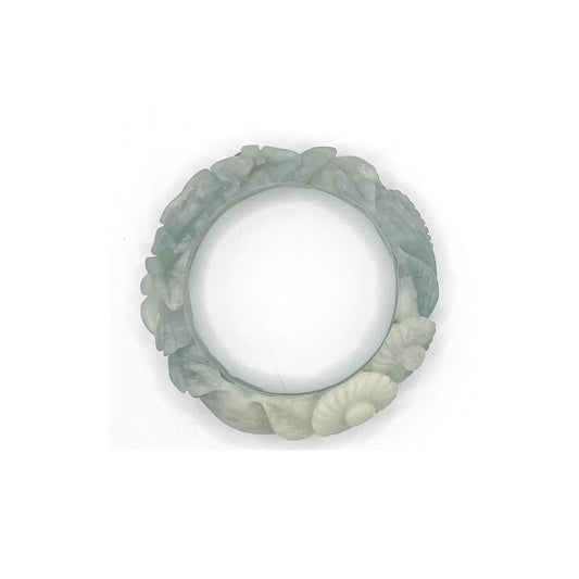 Hand-carved blue jade bangle with floral motifs including peonies and daisies, crafted from Mongolian quartzite in sky-blue and white hues.