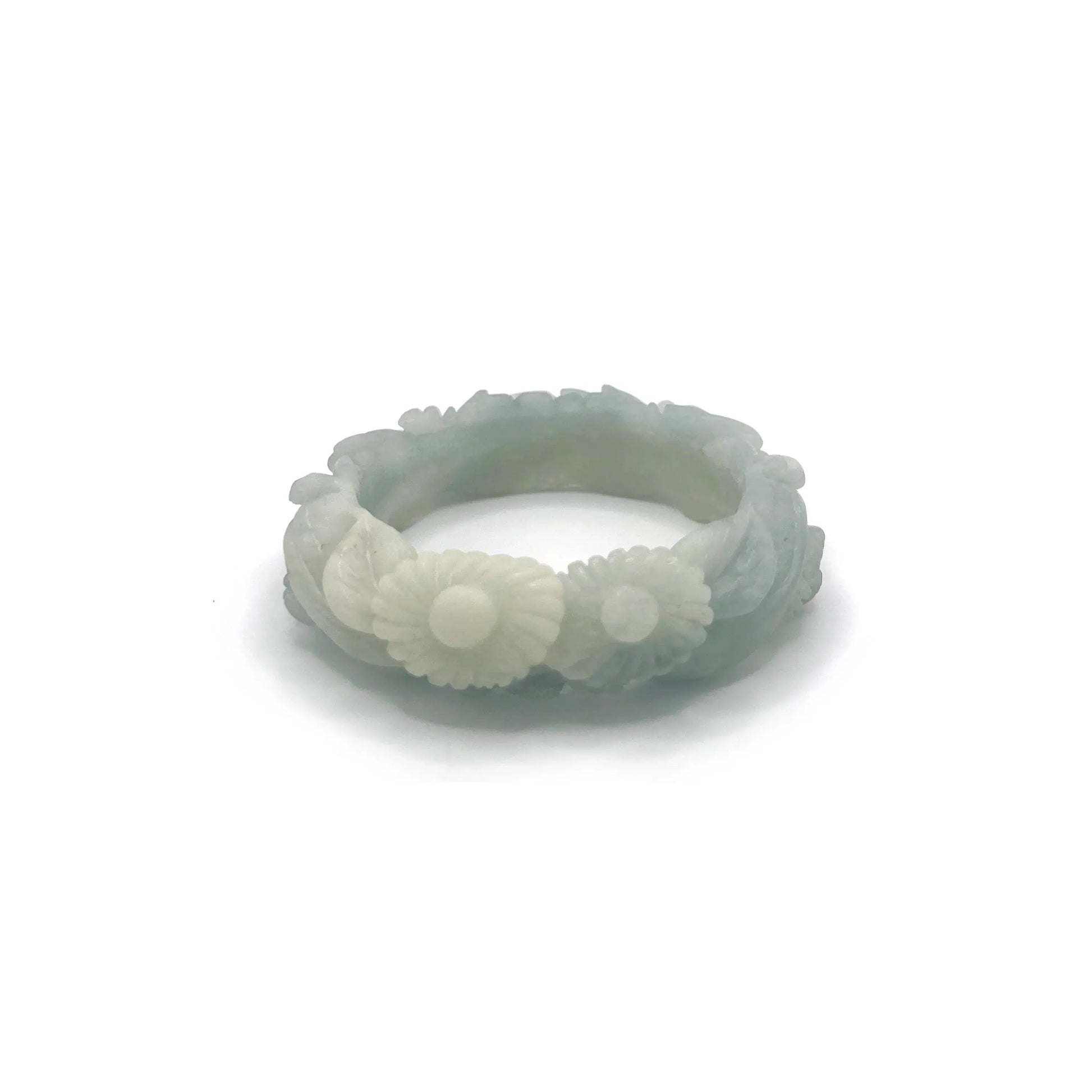 Hand-carved blue jade bangle with floral motifs including peonies and daisies, crafted from Mongolian quartzite in sky-blue and white hues.