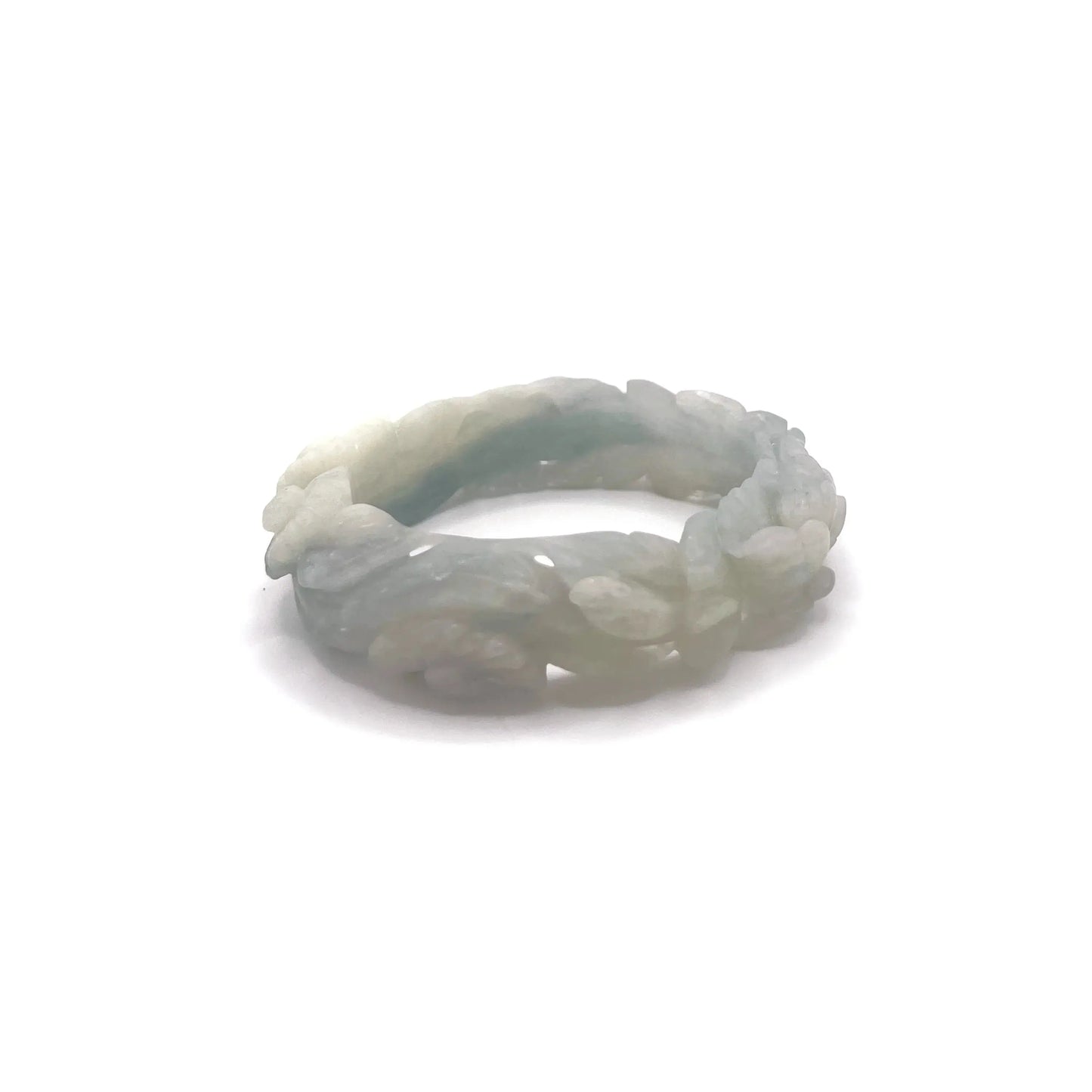 Hand-carved blue jade bangle with floral motifs including peonies and daisies, crafted from Mongolian quartzite in sky-blue and white hues.