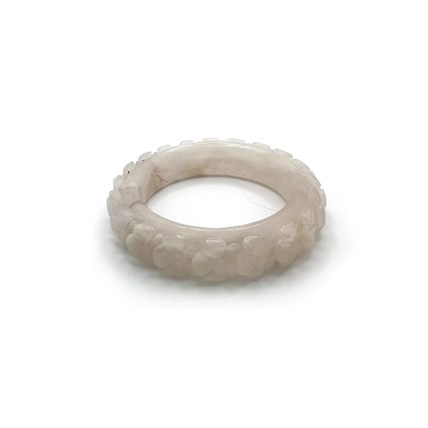 Carved bangle bracelet made from Mongolian jade, featuring cherry blossom motifs in soft white and pink tones, symbolizing renewal and springtime beauty.