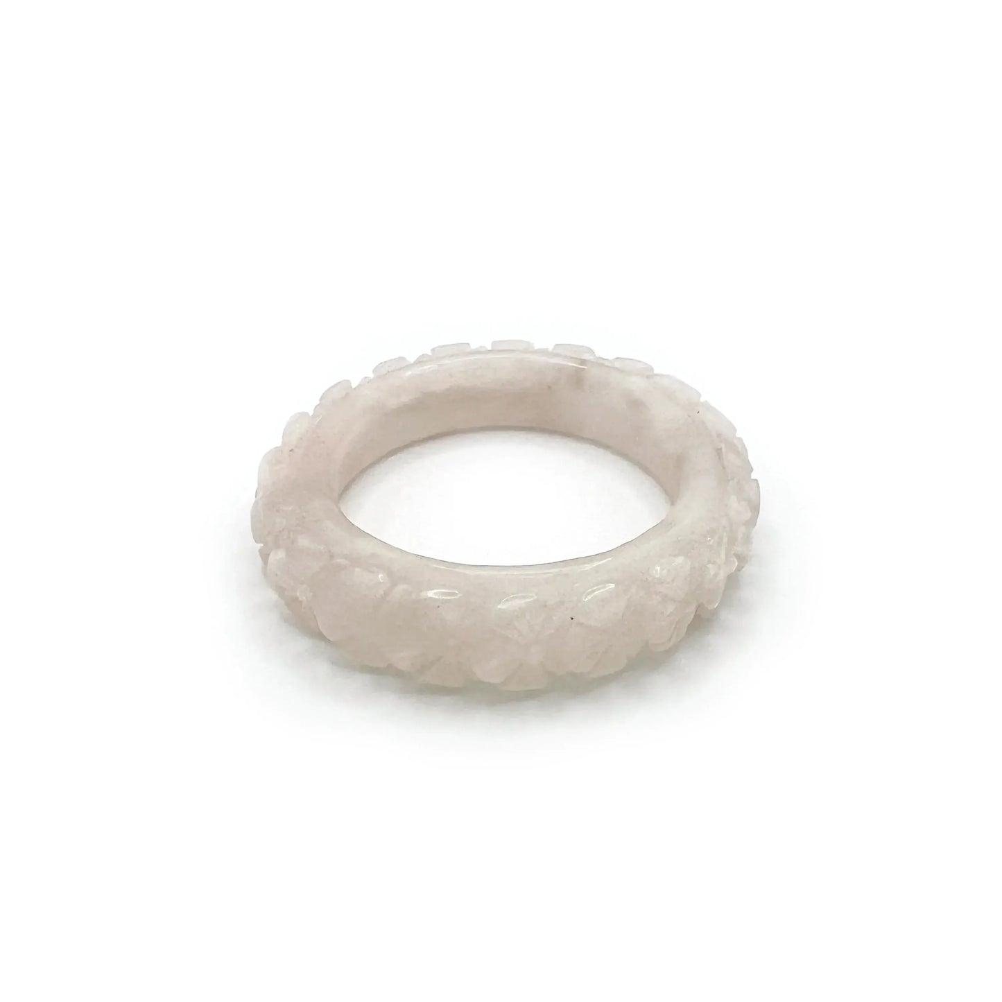 Carved bangle bracelet made from Mongolian jade, featuring cherry blossom motifs in soft white and pink tones, symbolizing renewal and springtime beauty.