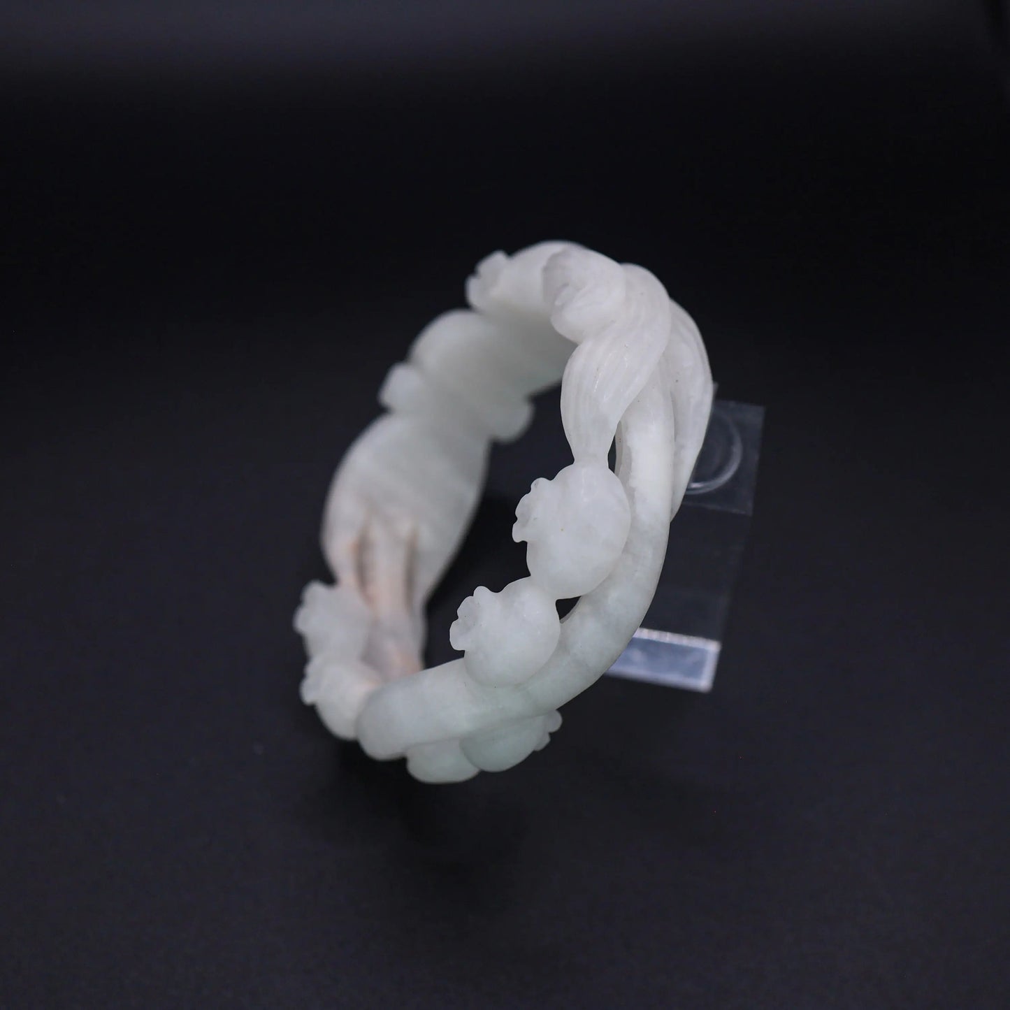 Natural jade bangle with hand-carved bluebells, floral vine, and elegant openwork design