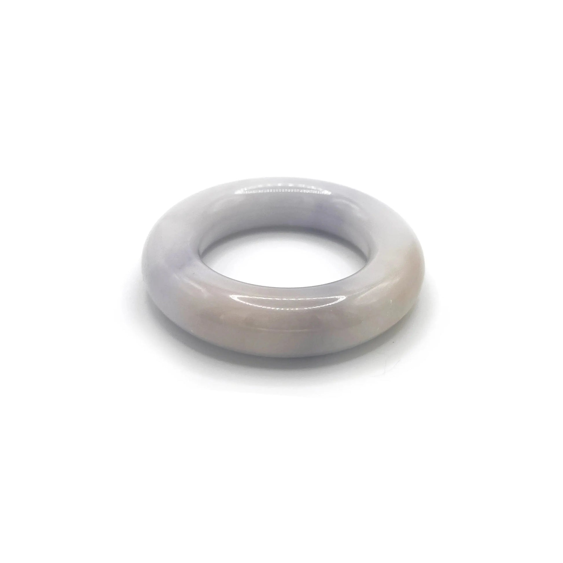 Donut bangle carved from Mongolian jade quartzite in soft lavender, featuring a smooth, rounded shape with translucent tones and natural artisan craftsmanship. - Miruzi
