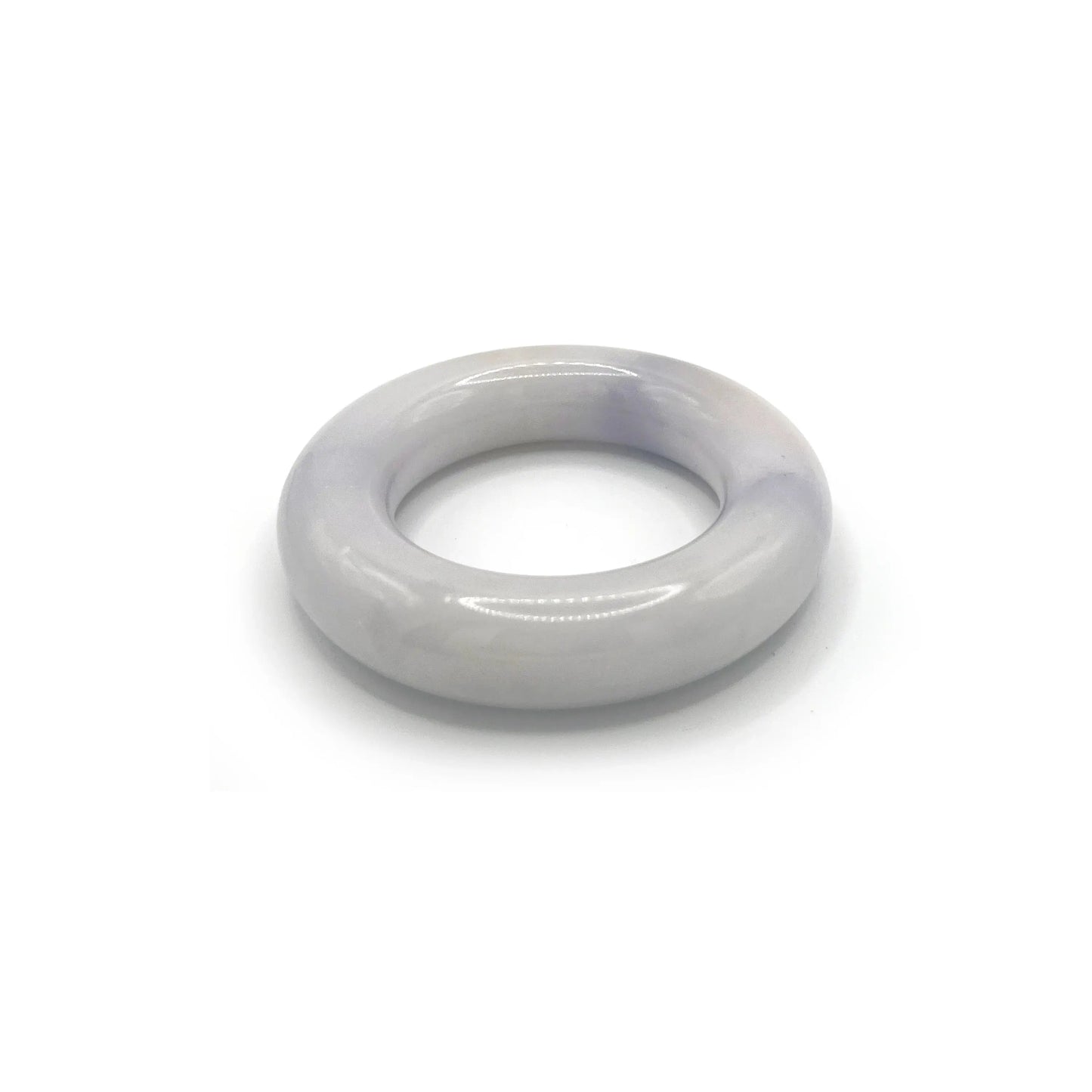 Donut bangle carved from Mongolian jade quartzite in soft lavender, featuring a smooth, rounded shape with translucent tones and natural artisan craftsmanship. - Miruzi