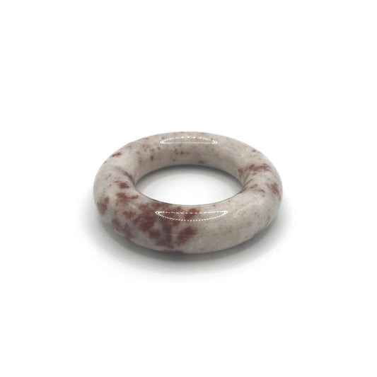 Snow Blossom Trace red floral donut bangle bracelet on cream Mongolian jade.