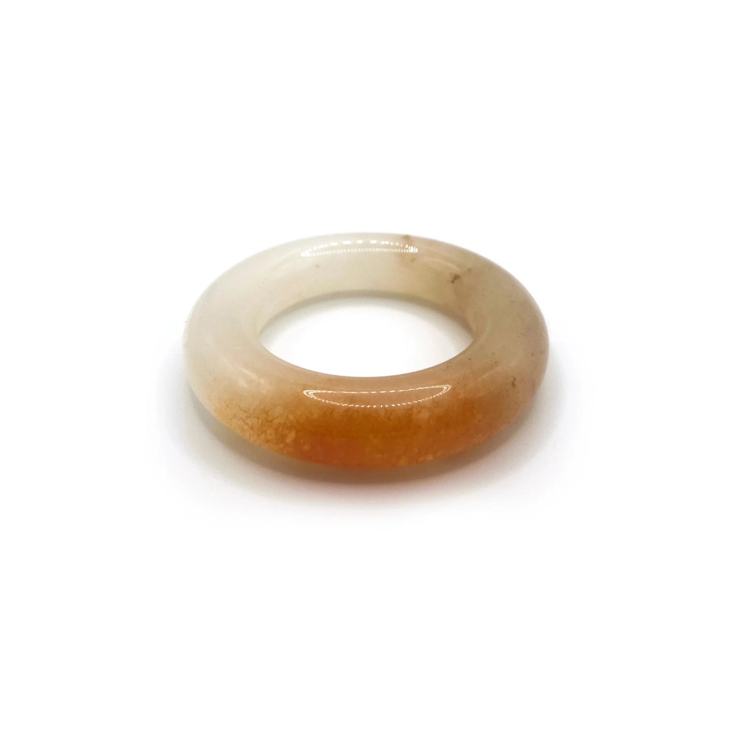 Donut bangle made from Mongolian jade featuring vibrant orange and white splashes, inspired by citrus soda with a playful, summer-ready design. - Miruzi