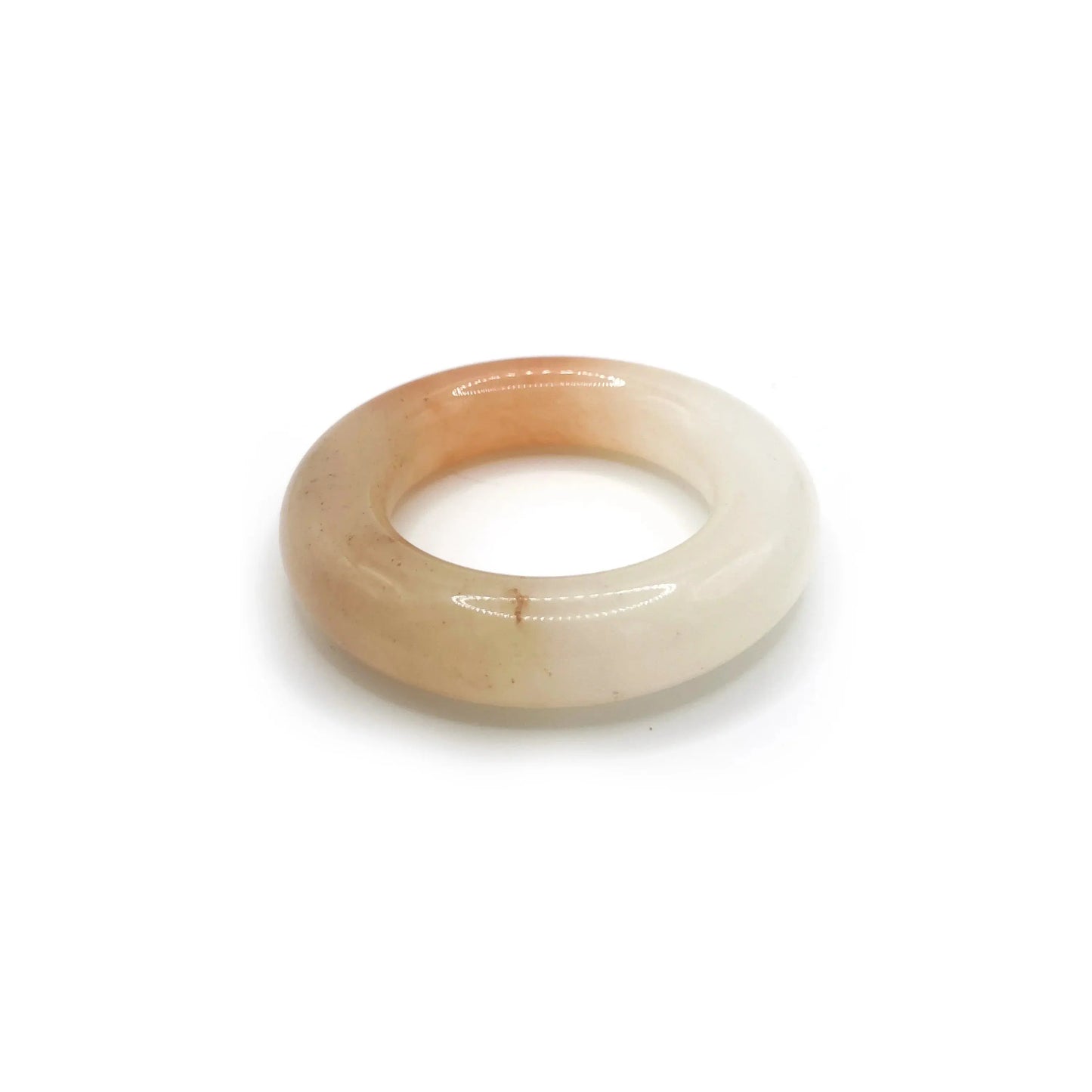 Donut bangle made from Mongolian jade featuring vibrant orange and white splashes, inspired by citrus soda with a playful, summer-ready design. - Miruzi