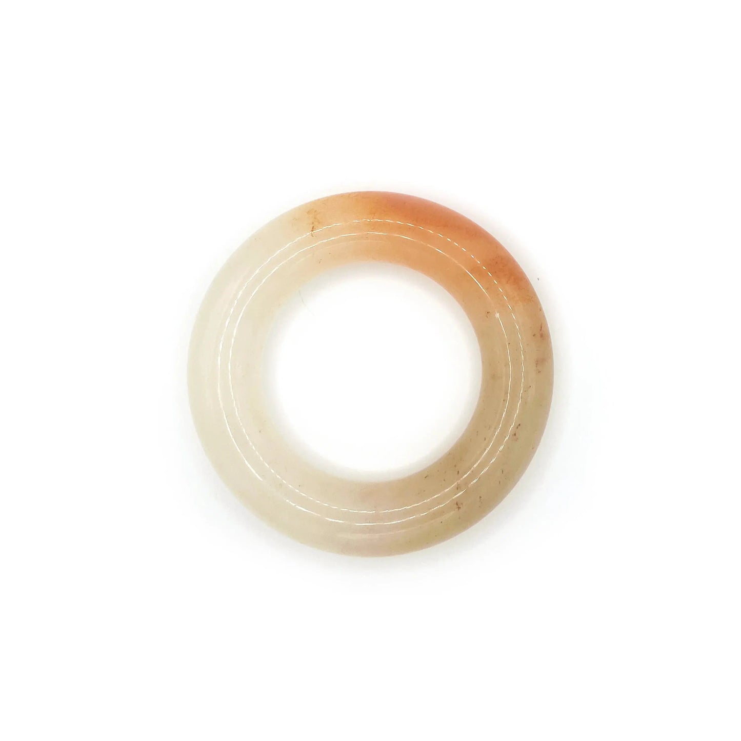 Donut bangle made from Mongolian jade featuring vibrant orange and white splashes, inspired by citrus soda with a playful, summer-ready design. - Miruzi