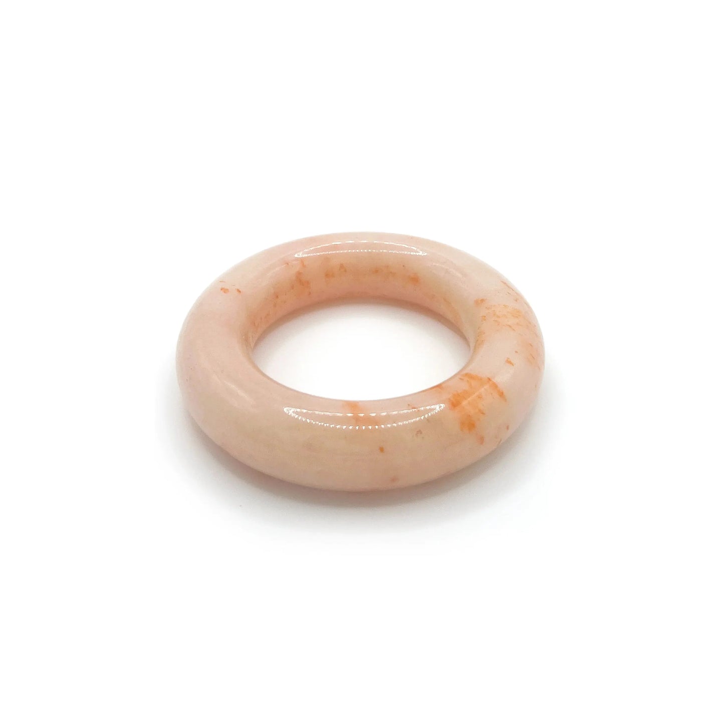 Donut bangle bracelet made of Mongolian jade quartzite in bright orange with jelly-like swirls, featuring a smooth rounded design for petite wrists.-Miruzi