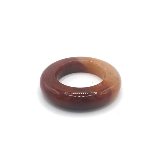 Chunky bracelet for women made from Mongolian jade quartzite, featuring deep wine red and charcoal tones in a thick, hand-carved bangle design.