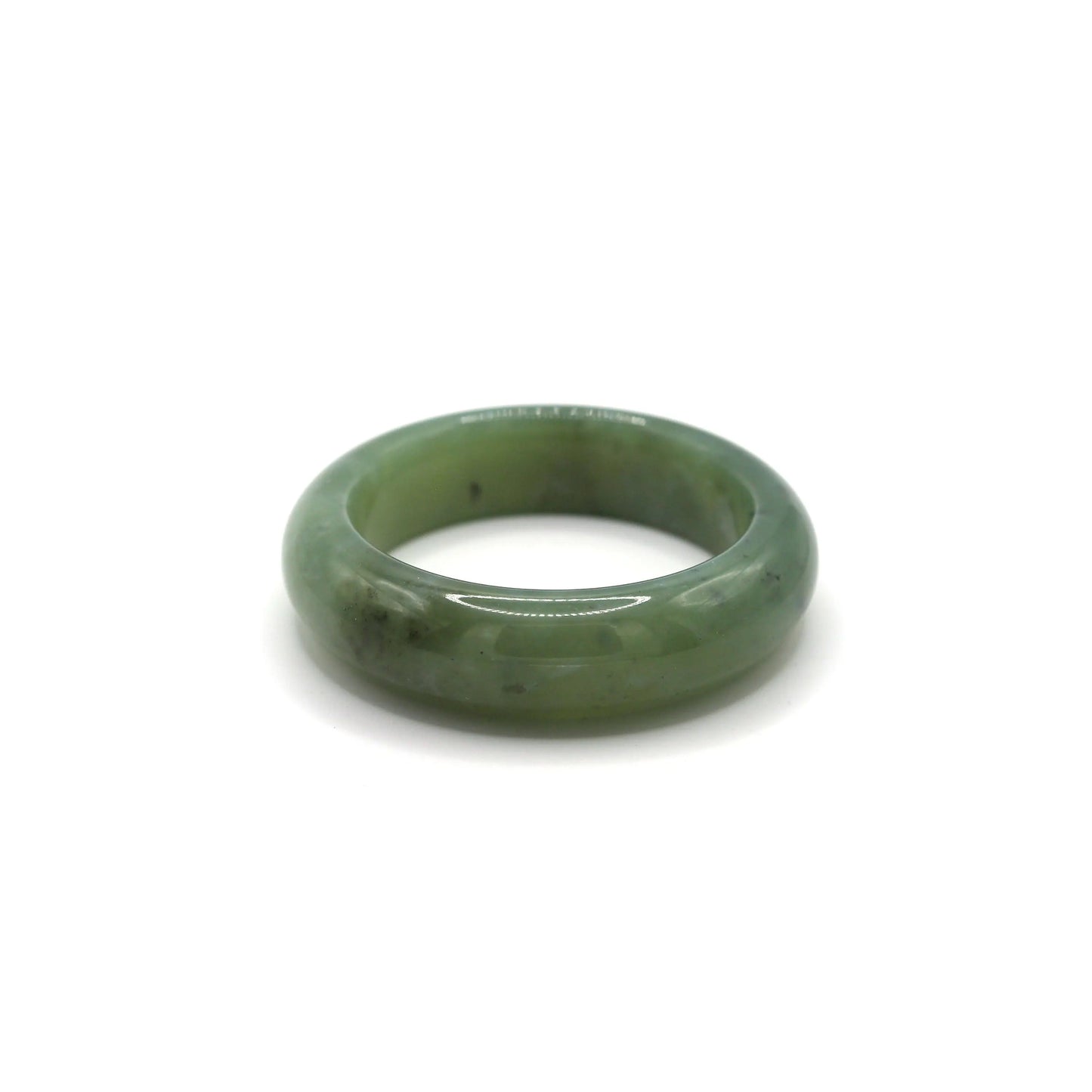 Jade bangle placed in a soft jewelry pouch showing layered color gradient Miruzi