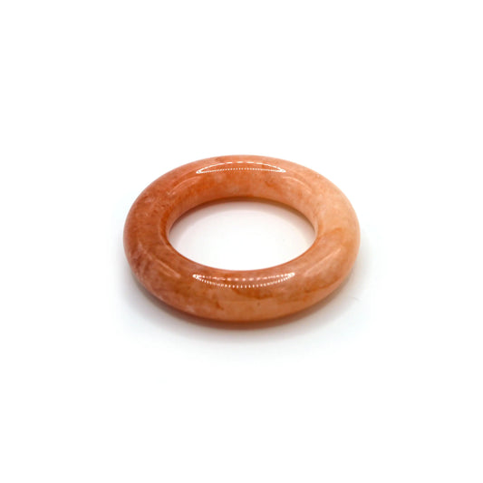 Elegant pink jade bangle with a soft blush-to-ivory gradient in a donut-style design, reflecting light in a serene and feminine way – Miruzi