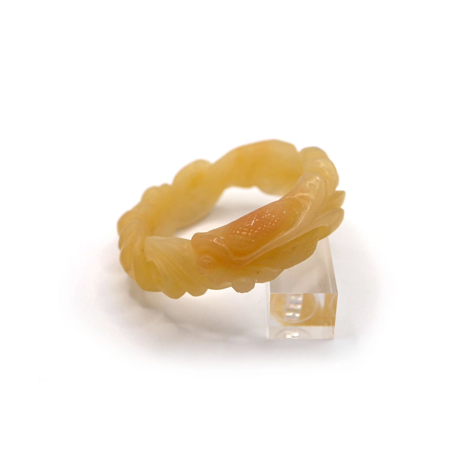 Polished Mongolian jade bangle in golden yellow, featuring high-relief carvings of symbolic flora and fauna with artistic precision – Miruzi