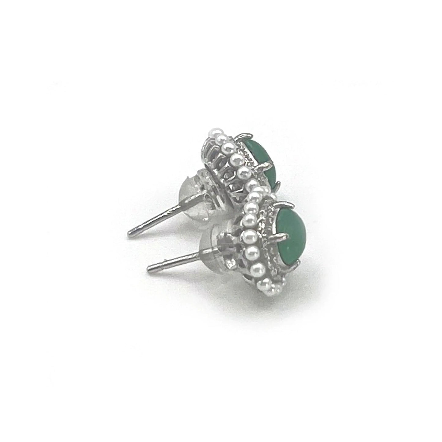 Jadeite stud earrings featuring deep green jadeite gemstones encircled by pearlescent accents, showcasing classic elegance and refined craftsmanship.