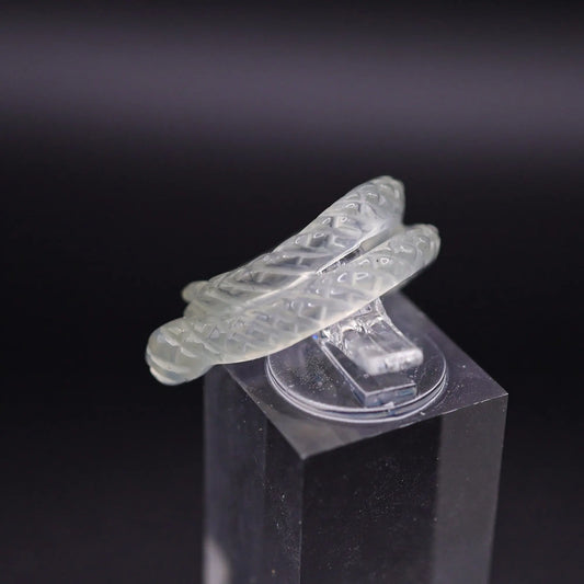 Handcrafted Ethereal Serpent Ring featuring an icy white serpentine base with a delicately carved snake wrapping around the finger, symbolizing wisdom and rebirth. The exquisite detailing and three-dimensional snake design make this ring a unique piece of enchanting, mythical-inspired jewelry, perfect for adding a touch of mystical elegance to any outfit.