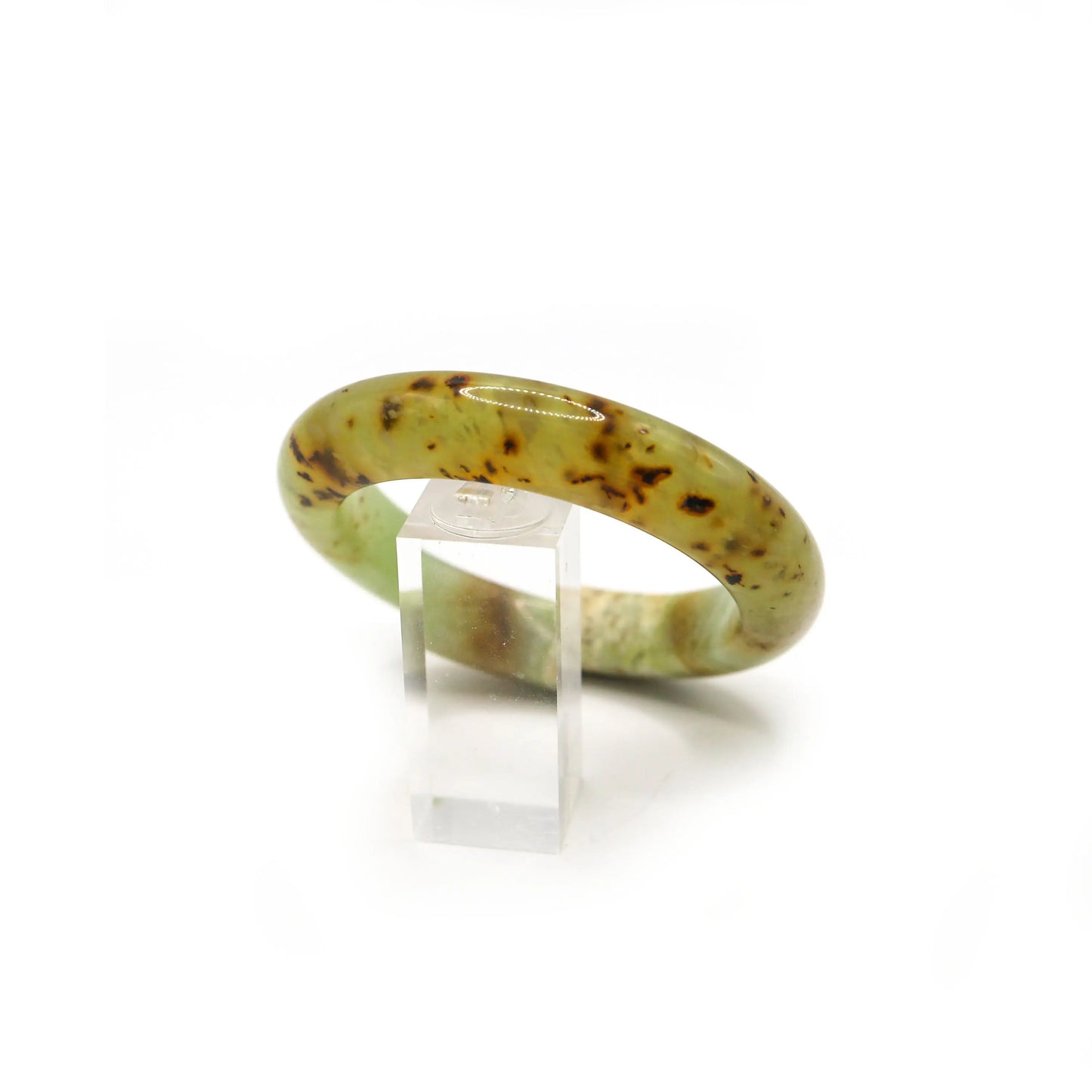 Side view of translucent jade bracelet revealing layered milky textures - Miruzi