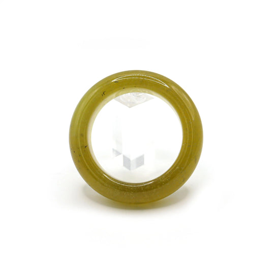 Radiant yellow jade bracelet featuring suspended micro-bubbles and high polish for a summery, luminous look. Miruzi