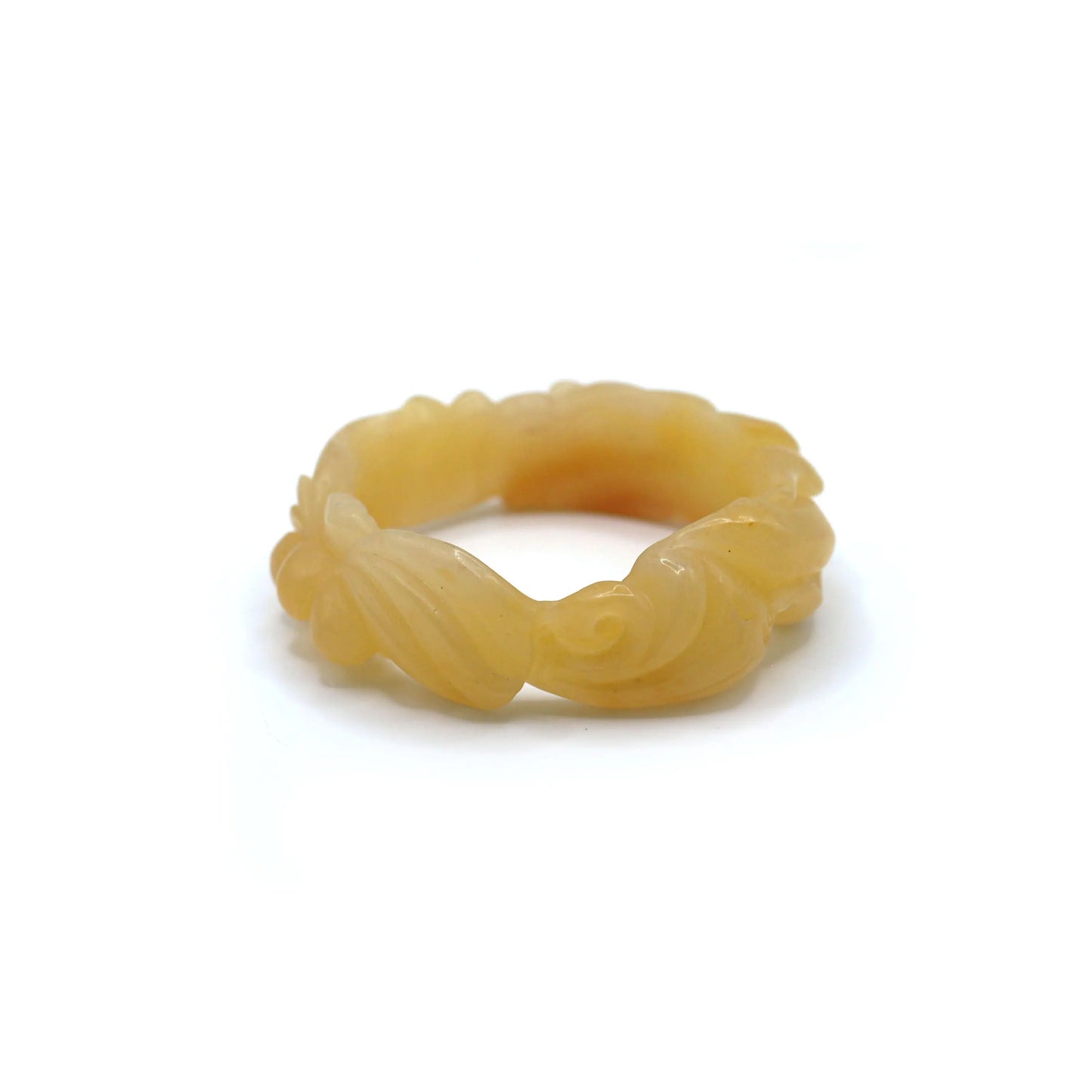 Artistic jade bracelet featuring organic motifs in yellow stone, combining motion and tranquility through fish and flower forms – Miruzi