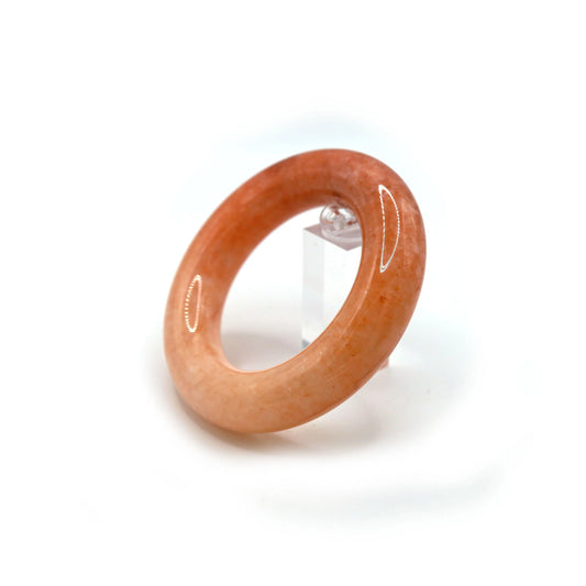 Close-up of Mongolian quartzite jade bangle featuring smooth rose tones blending into creamy white, like silk in morning light – Miruzi