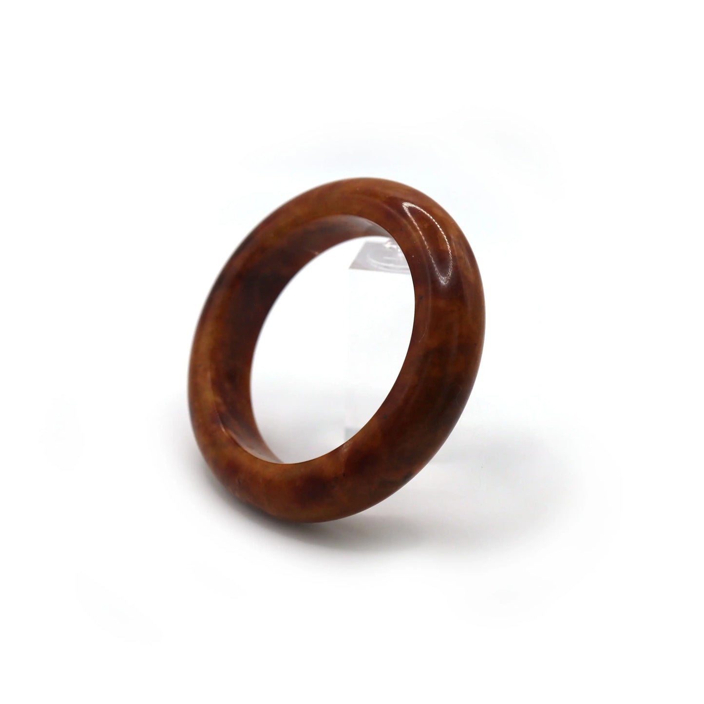 Close-up of crimson jade bangle showing detailed golden mineral striations Miruzi