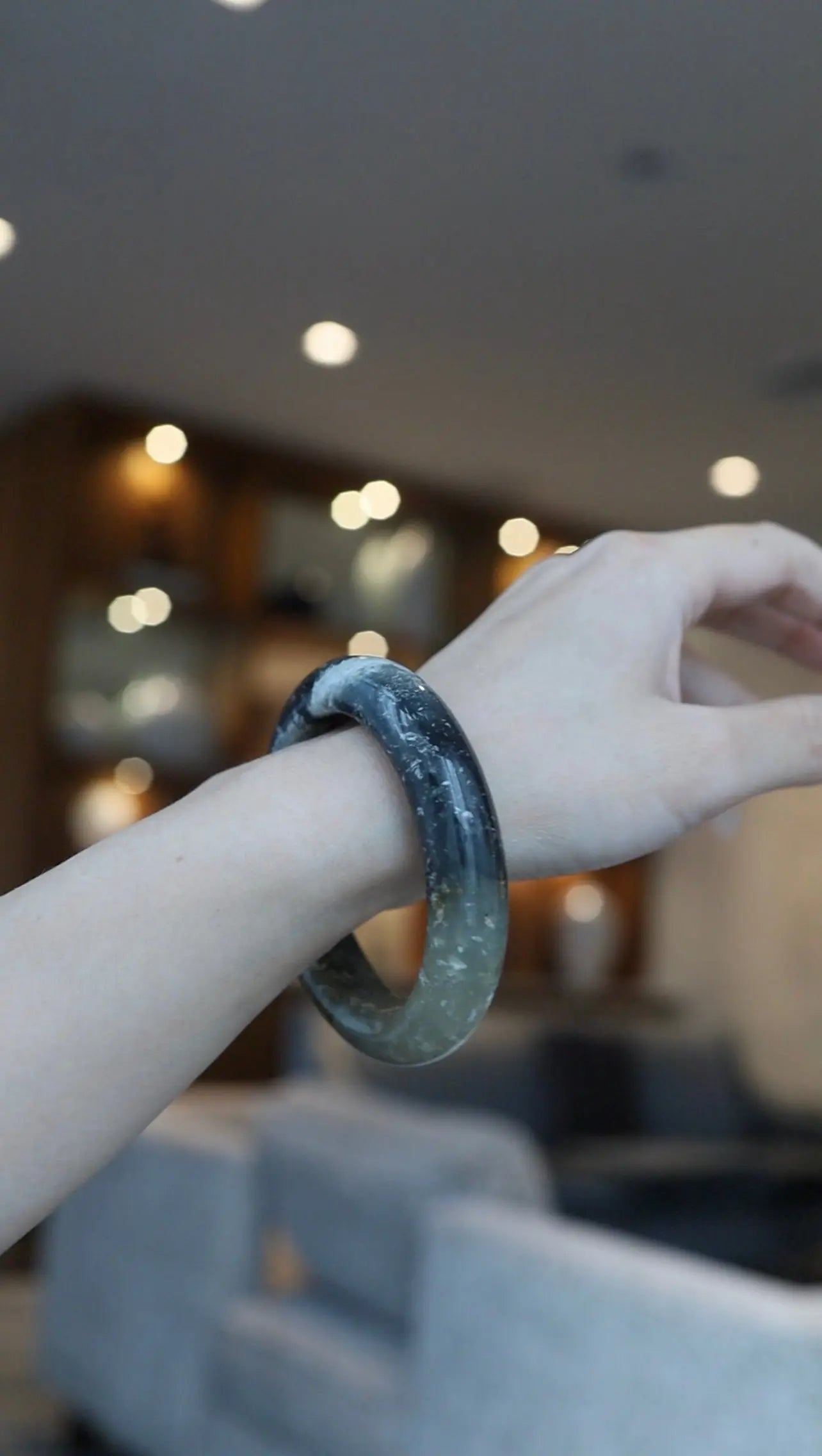 Full-circle XS bangle made from natural Mongolian jade, featuring painterly marbling of black, gray, and translucent tones for a serene contrast – Miruzi