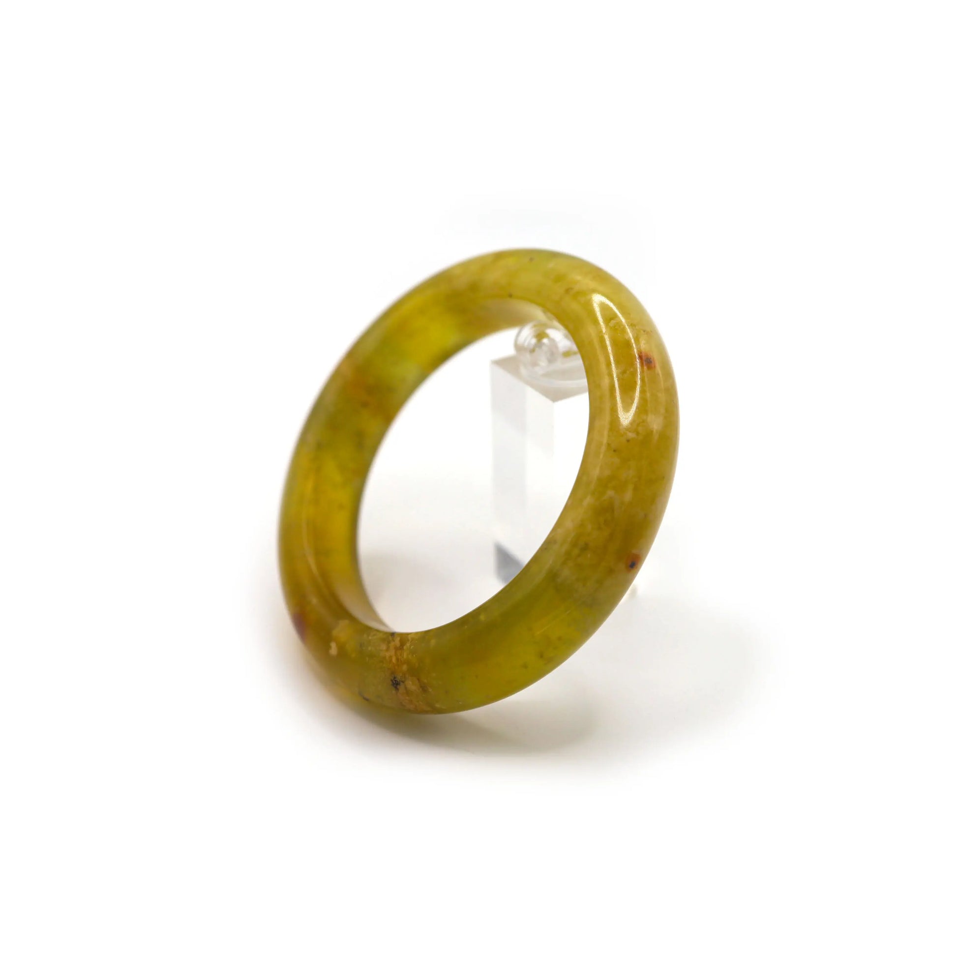 Pale golden jade bracelet with misty clarity and faint mineral threads, photographed under diffused daylight for a serene aesthetic. - Miruzi