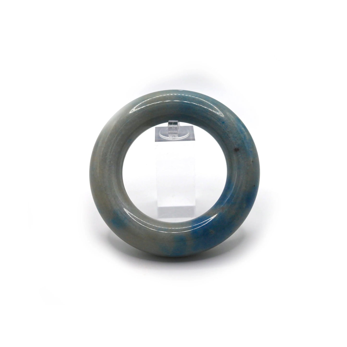Donut-shaped jade bracelet showing subtle motion through mineral veins, like light skies captured in natural stone – Miruzi