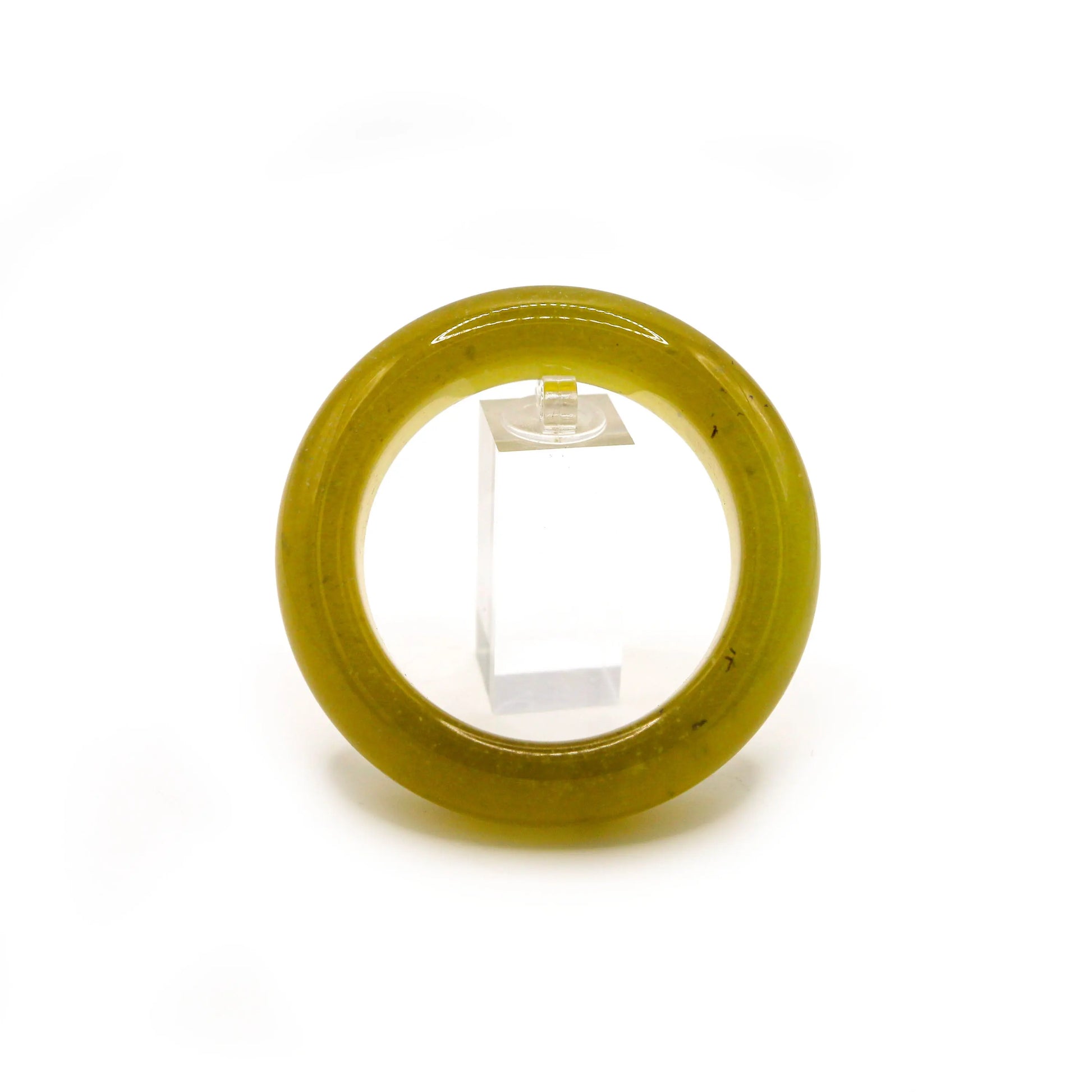Lightweight yellow jade bangle glowing with amber hues and shimmering micro-bubbles, displayed on neutral background.
 Miruzi