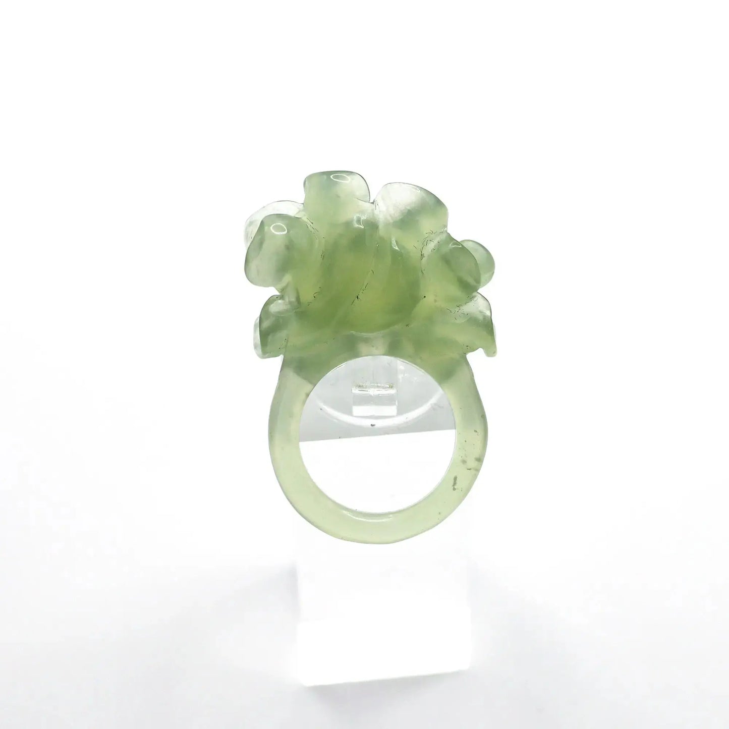 Lotus flower ring hand-carved from serpentine, featuring a soft green lotus bloom atop a clear base—symbolizing purity, peace, and artistic elegance.