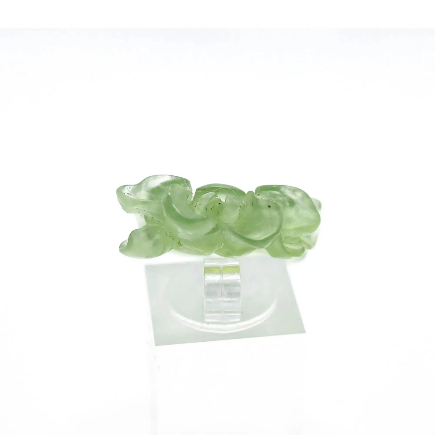 Lotus flower ring hand-carved from serpentine, featuring a soft green lotus bloom atop a clear base—symbolizing purity, peace, and artistic elegance.