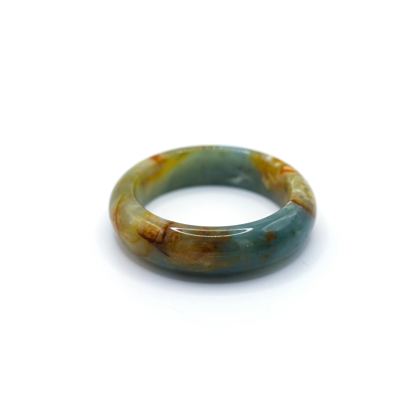 Blue jade bracelet styled with ivory silk and denim, highlighting the calming blue stone and flowing natural veins – Miruzi