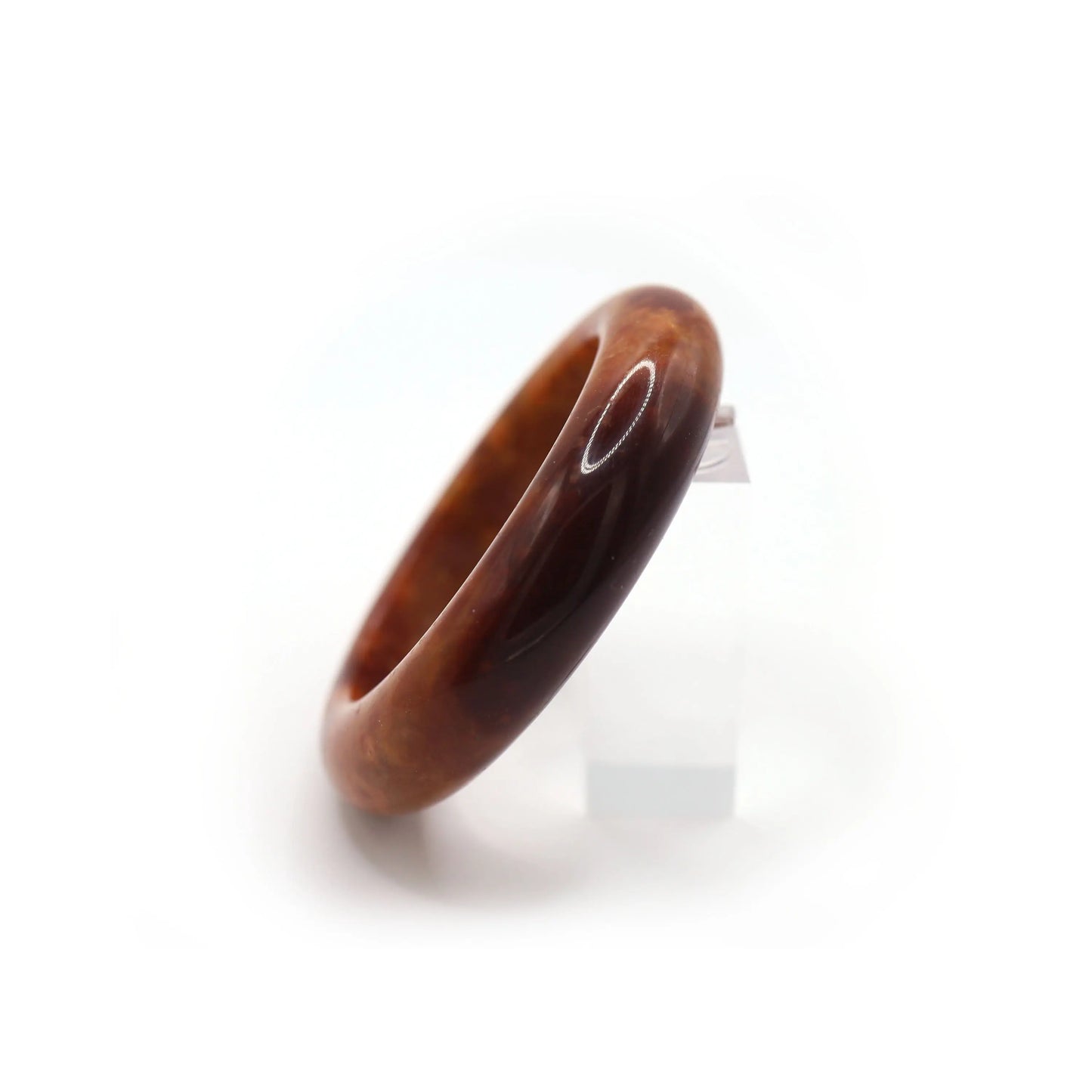 Side angle of jade bracelet showing mineral patterns and glowing finish Miruzi