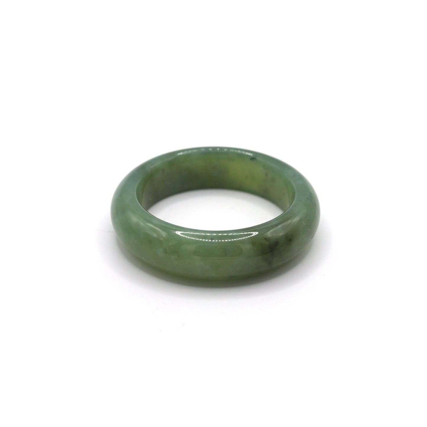 Wrist wearing light green jade bangle with visible charcoal inclusions Miruzi