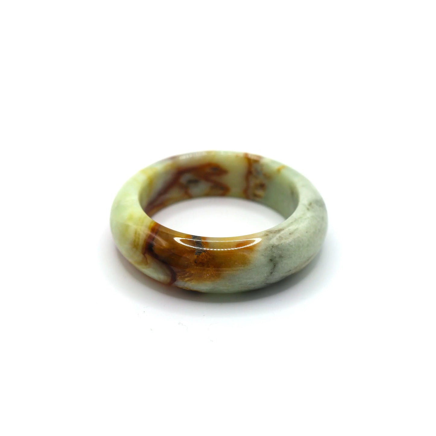 Jade bracelet styled with ivory and walnut-toned fabrics for earthy contrast Miruzi