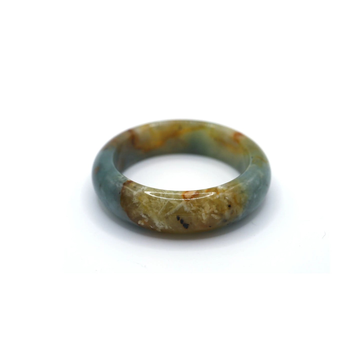 Deep ocean-blue jade bracelet with natural golden and white veining resting on soft fabric, capturing the feel of sunlit waters – Miruzi