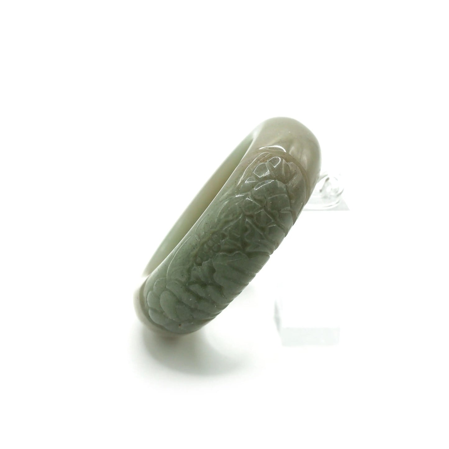 Elegant green jade bangle carved with a single peony flower, showcasing quiet refinement and natural harmony in asymmetry – Miruzi