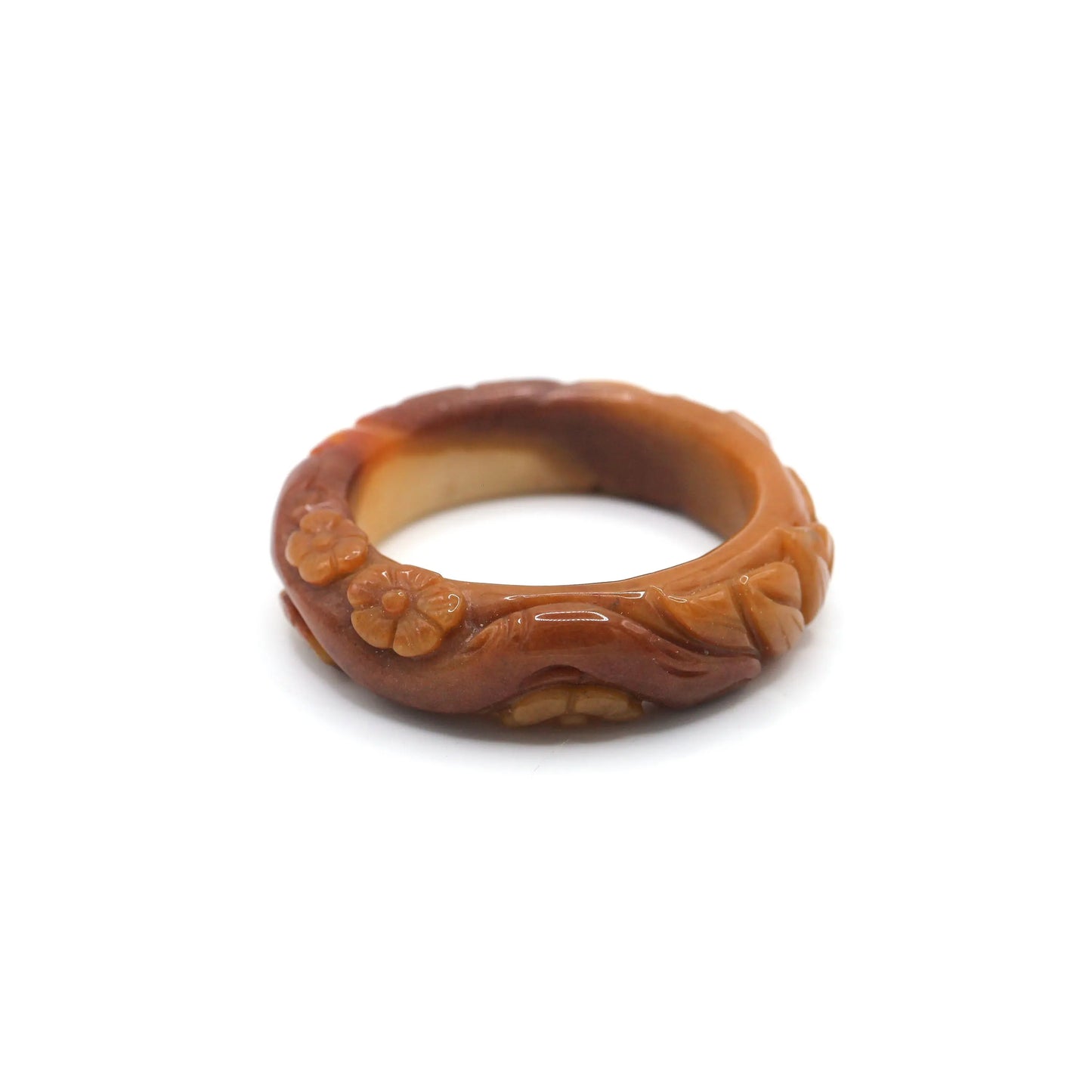 A radiant orange jade bracelet featuring a full lotus surrounded by tiny blossoms, glowing with inner translucency and fire – Miruzi