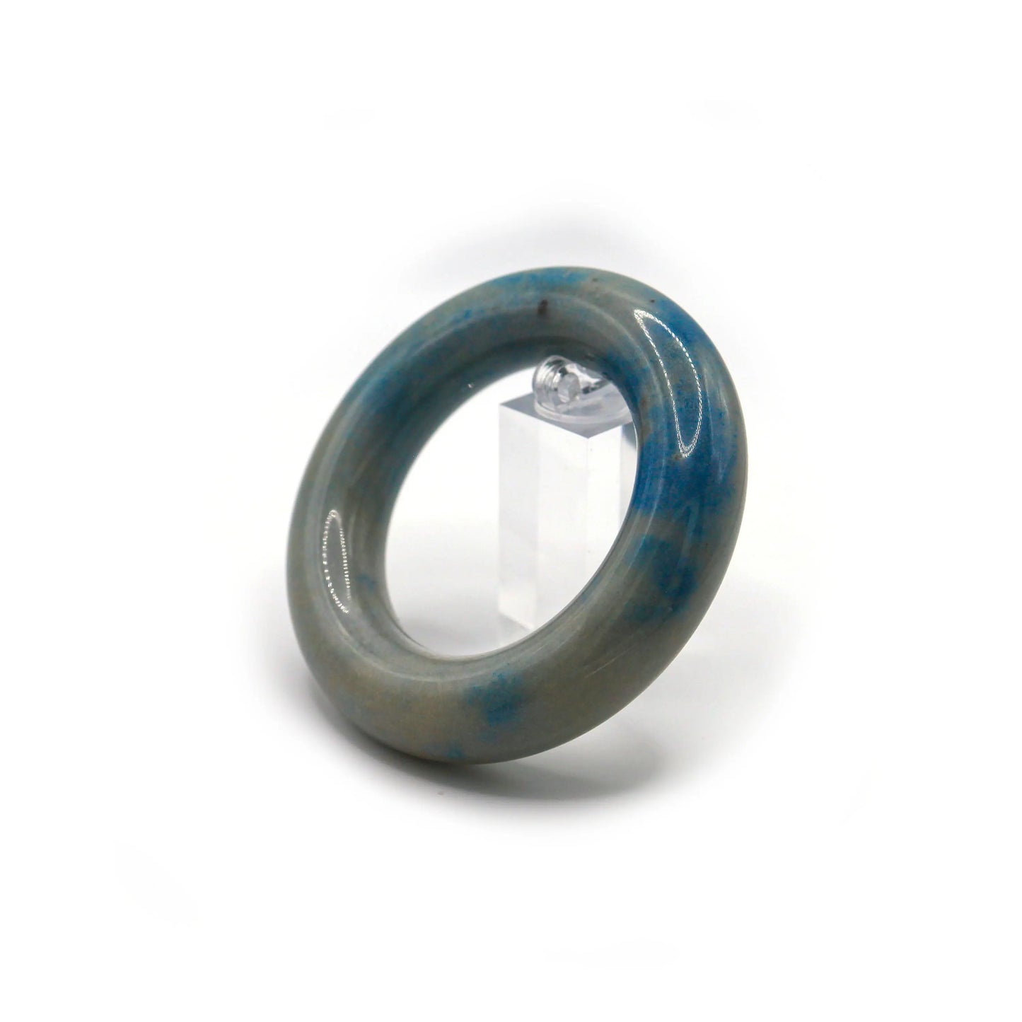 Handcrafted jade bracelet in rounded form with cloud-blue inclusions layered across an ivory-toned translucent stone – Miruzi